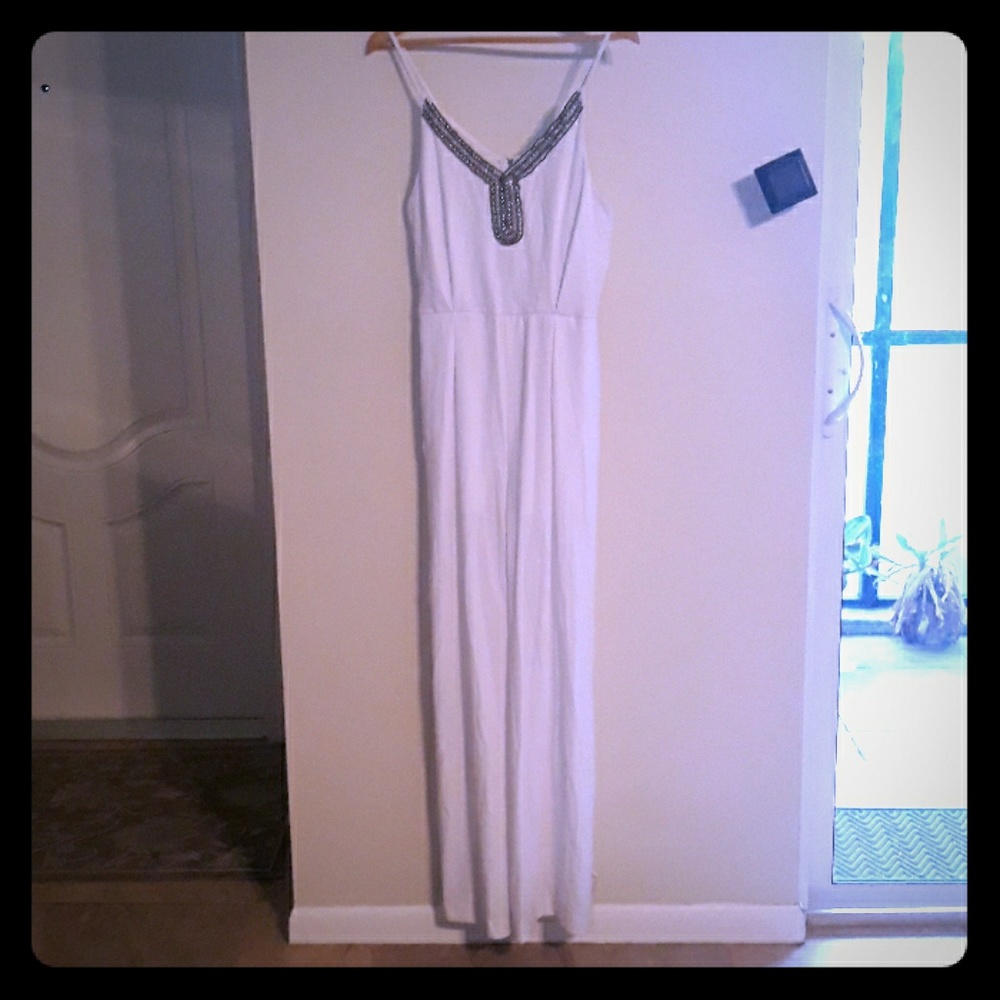 An XOXO white jumper with silver beading.